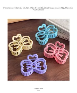 Détail de pinces à cheveux papillon mates colorées dimensions 8,8x5,9x4,6 cm