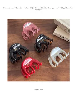 Top view of five color acetate hair clips with dimensions 6.5x4.5x3.6cm and gold logo