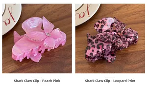 Detail view of butterfly claw clips with rhinestones in peach and leopard pattern