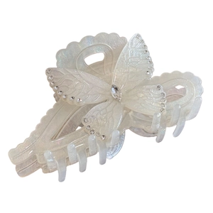 Elegant butterfly hair claw clip with pearl white finish and crystal rhinestone accents