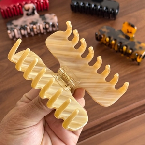 French style acetate claw clip with cream marble texture for elegant ponytails