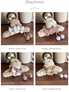 Detailed macro view of plush bow hair clips with pearl tassels and soft fur balls