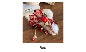 Detailed close-up of a red houndstooth bow hair claw with plush fur and pearl tassels