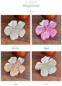 Detailed view of acetic floral shark hair clips with rhinestones in four colors