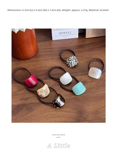 Detail showing acetate hair ties in multiple colors with 6.2cm length and 4.2cm width