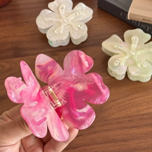 Elegant floral acetate hair claw clip with marble texture and delicate crystal accents
