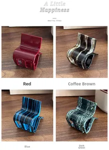 Detailed grid view showing four colors of striped acetate ponytail hair claw clips