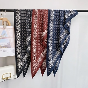 Three-color set of vintage geometric patterned scarves in black, brown and navy blue