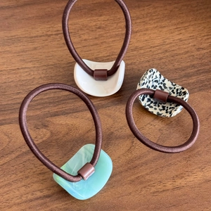 Three-piece acetate geometric hair ties set in white, marble green and spotted patterns