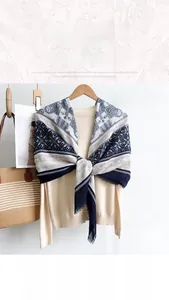 Detail of soft 130cm linen-silk scarf with ethnic geometric print and fringed edges