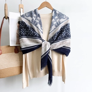Ethnic pattern cotton linen shawl scarf with fringes over a beige knit sweater