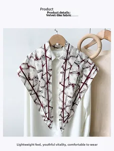 Detail showing high-quality faux velvet fabric with red geometric pattern on white scarf