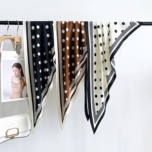 Summer retro polka dot silk scarf in black and white hanging as a versatile shawl
