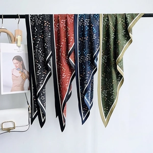 Floral print triangular silk scarf set in black, rust red, navy, and olive green