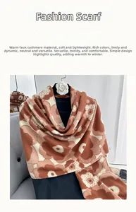 Detailed texture of imitation cashmere scarf featuring floral patterns in beige and brown
