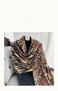 Close-up of leopard print leopard pattern scarf made of soft cashmere-like fabric