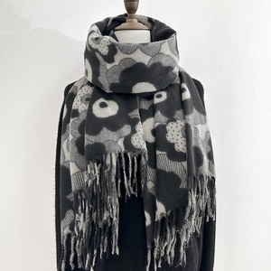 Thick floral print winter scarf with black and white poppy pattern and tassel edges