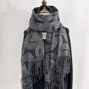 Thick warm dark grey cashmere-feel long scarf with white geometric patterns and tassels