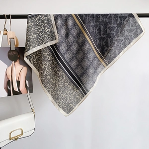 Gray vintage silk square scarf with floral print for women, hung as a fashion accessory
