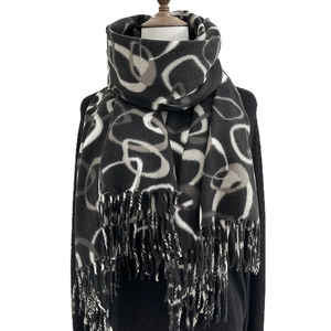 Winter thick scarf for women featuring black and white abstract ring patterns with tassels