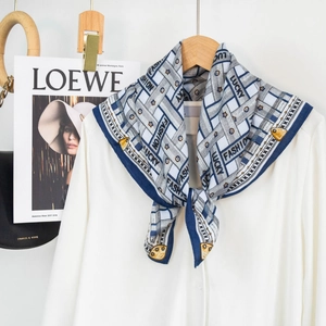 Fashion square silk scarf with geometric print and floral details on a white shirt collar