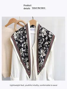 Close-up of imitation silk floral triangle scarf paired elegantly with a white shirt