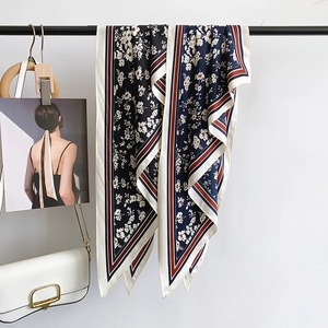 Elegant floral print triangle scarf with stripe borders for versatile hair or neck styling