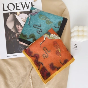 Elegant velvet square scarves featuring traditional crane prints in blue and orange red