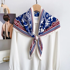 Detail of French vintage scarf with navy blue and red geometric nautical patterns