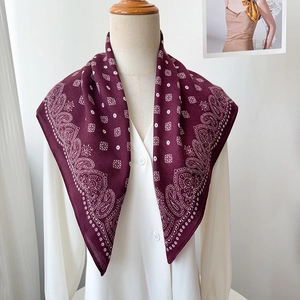 Elegant burgundy paisley and polka dot square scarf styled on a white shirt