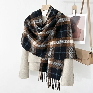 Classic plaid cashmere-feel scarf with tassels over a beige wool coat for winter warmth