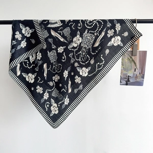French luxury silk scarf with classic black and white camellia print and satin finish