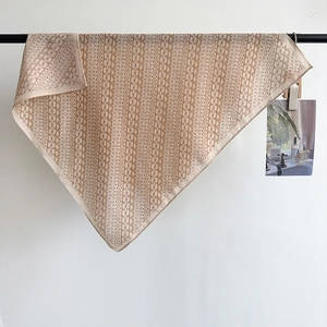 Elegant herringbone square silk scarf with vintage brown chain patterns on beige fabric