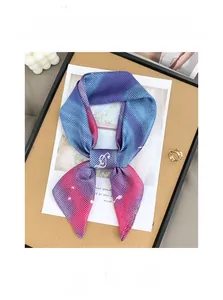 Detailed texture of blue-pink gradient silk scarf with white polka dot pattern and soft glow