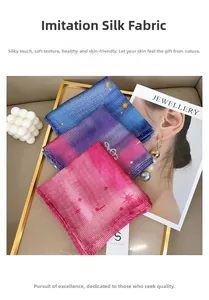 Detail of faux silk square scarf featuring star gradient colors in a golden tray setup