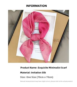 Detailed view of pink checkered silk scarf with 70x70cm size label in a chic layout