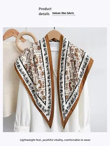 Detail of imitation velvet scarf with vintage horse carriage print on white shirt