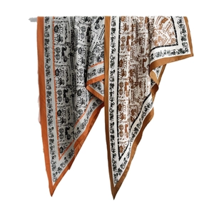 Elegant silk scarf with classic horse carriage pattern in caramel and black tones
