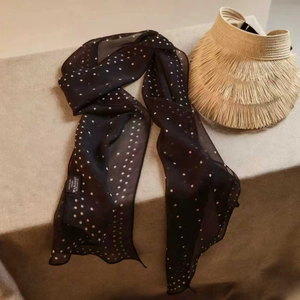 French romantic black polka dot 100% mulberry silk scarf on beige textured background