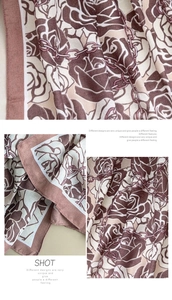Detail view of cotton linen scarf with floral rose print and fine rolled edge finish