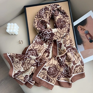 Elegant floral silk-like scarf with rose and chain print in coffee and beige tones