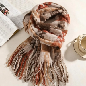 Classic blue and brown checkered scarf with long tassels in a warm retro aesthetic layout