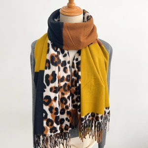 Long leopard print scarf with color-block knit design and stylish fringe tassels
