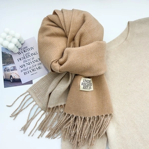 Chic camel cashmere-feel winter scarf with decorative tassels and a stylish woven label