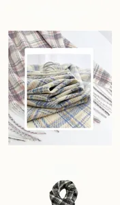 Detailed macro view of soft cashmere-like fabric texture and fringe on plaid scarves