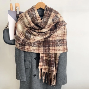 Checkered warm scarf with tassels in brown and beige tones for autumn and winter outfits