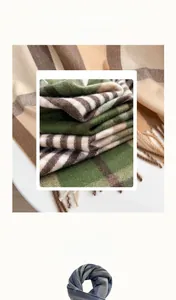 Detail eines hochwertigen Cashmere-Imitat-Schals mit weichem Karomuster und Fransenkante