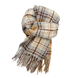 Soft plaid scarf in grey, blue, and yellow with fringes on a clean white background