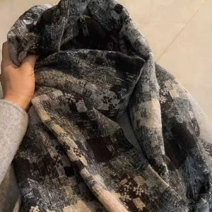 Thick vintage checkered scarf in grey and beige tones with a soft plush texture