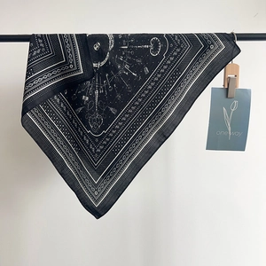 Vintage paisley square scarf featuring gothic skull print on elegant black background